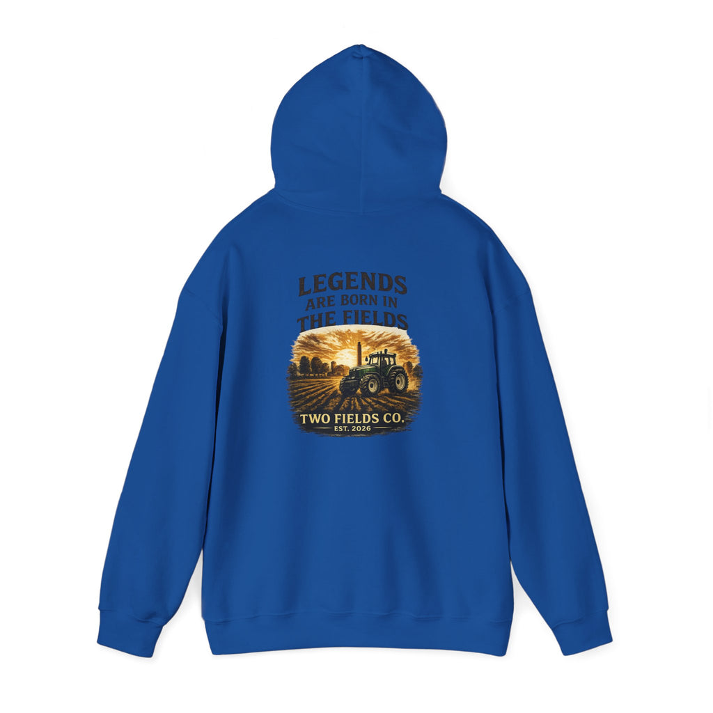 Royal blue pullover hoodie with hood up; tractor scene graphic on back