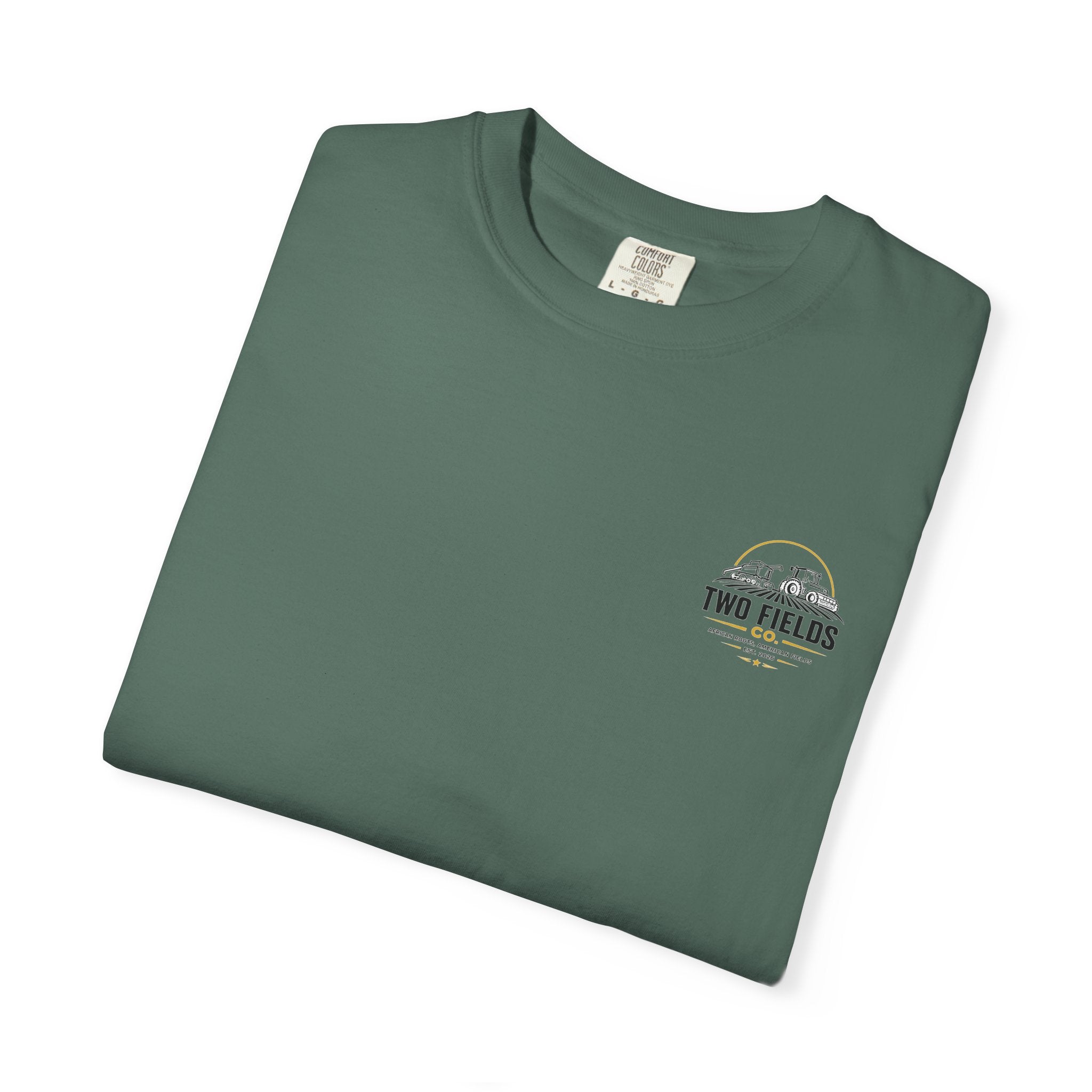 Green t-shirt folded with small chest “Two Fields Co.” logo