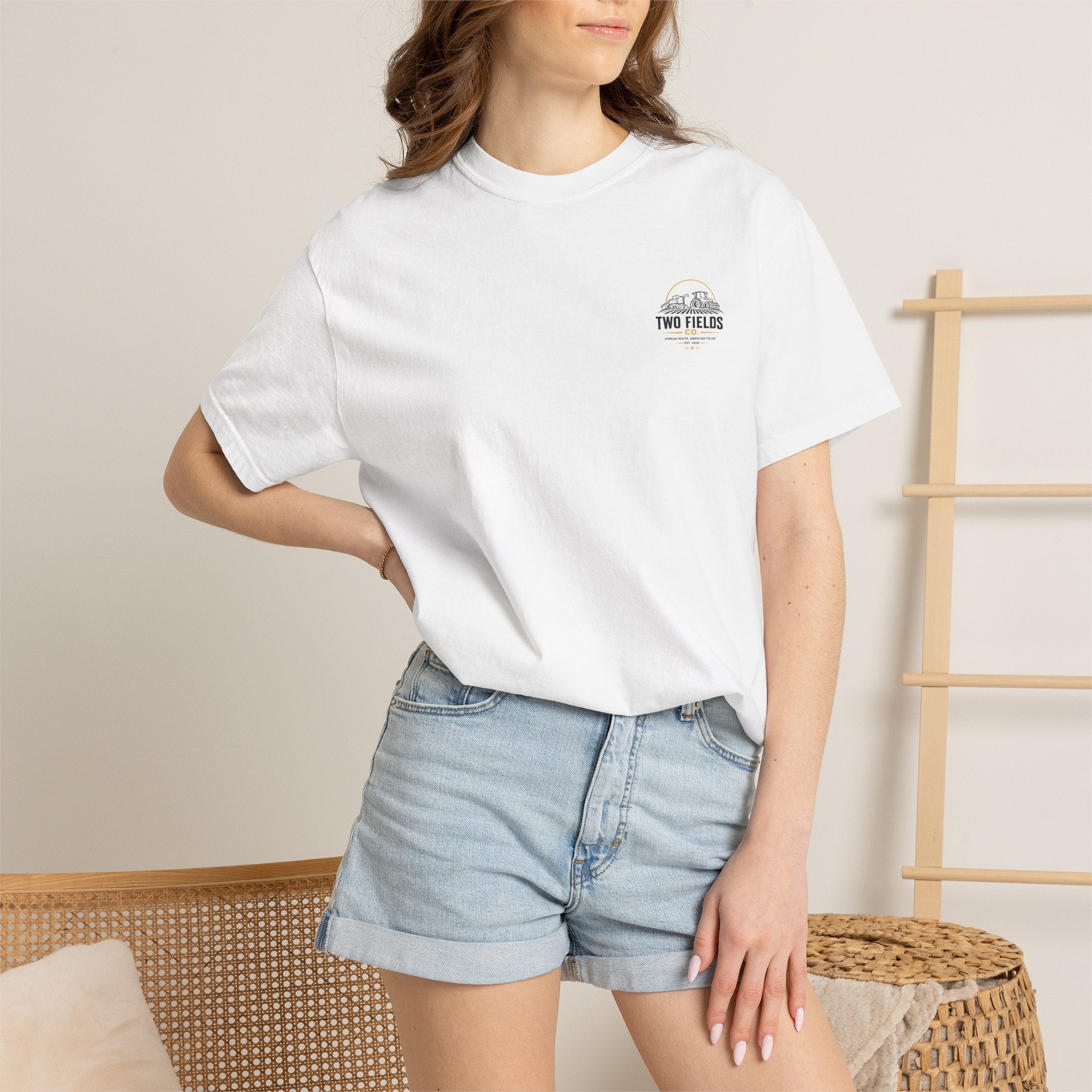 White crewneck graphic T-shirt with small chest logo patch