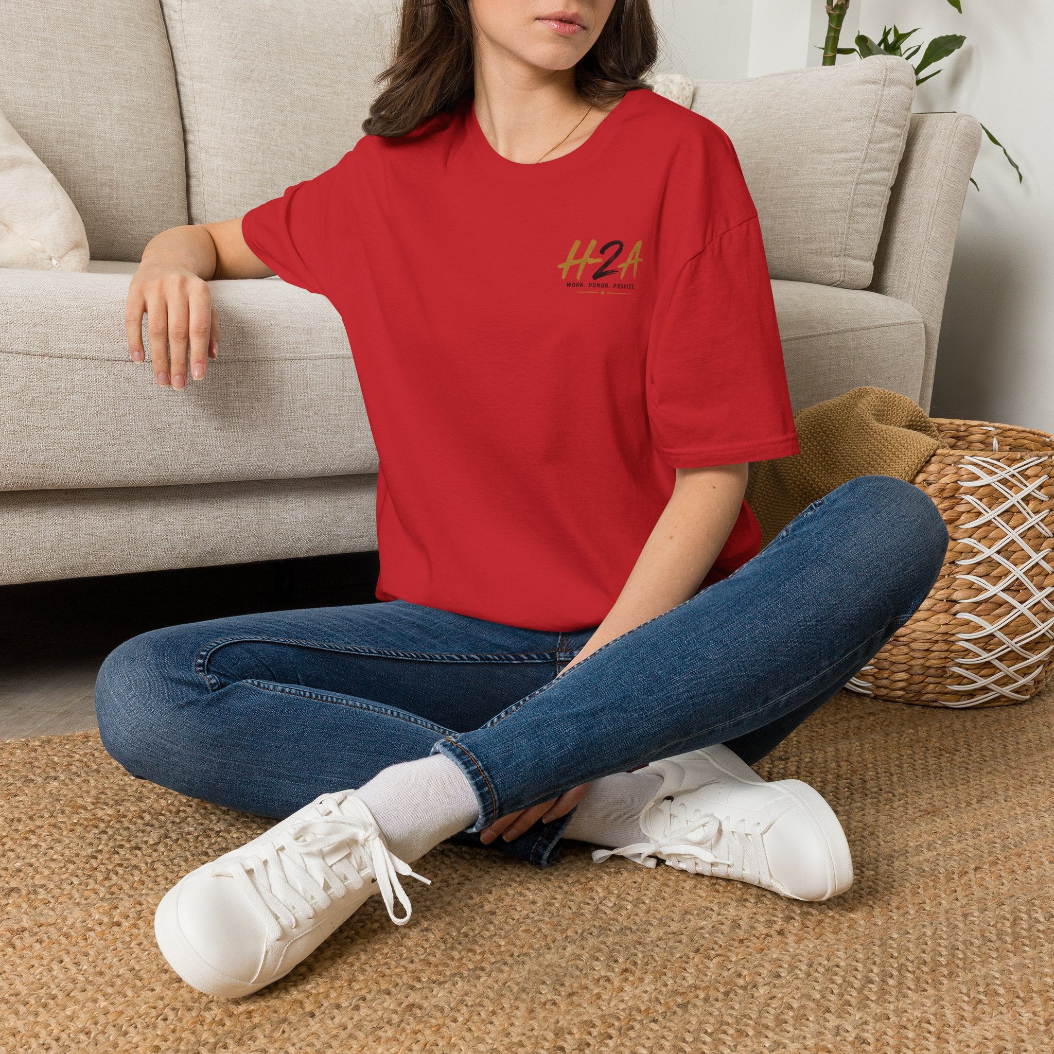 Unisex softstyle T-shirt in red with small chest H2A logo worn by model