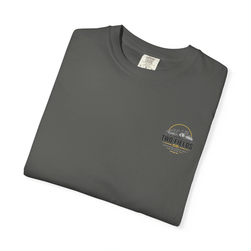 Dark gray graphic t-shirt folded flat with small chest Two Fields logo