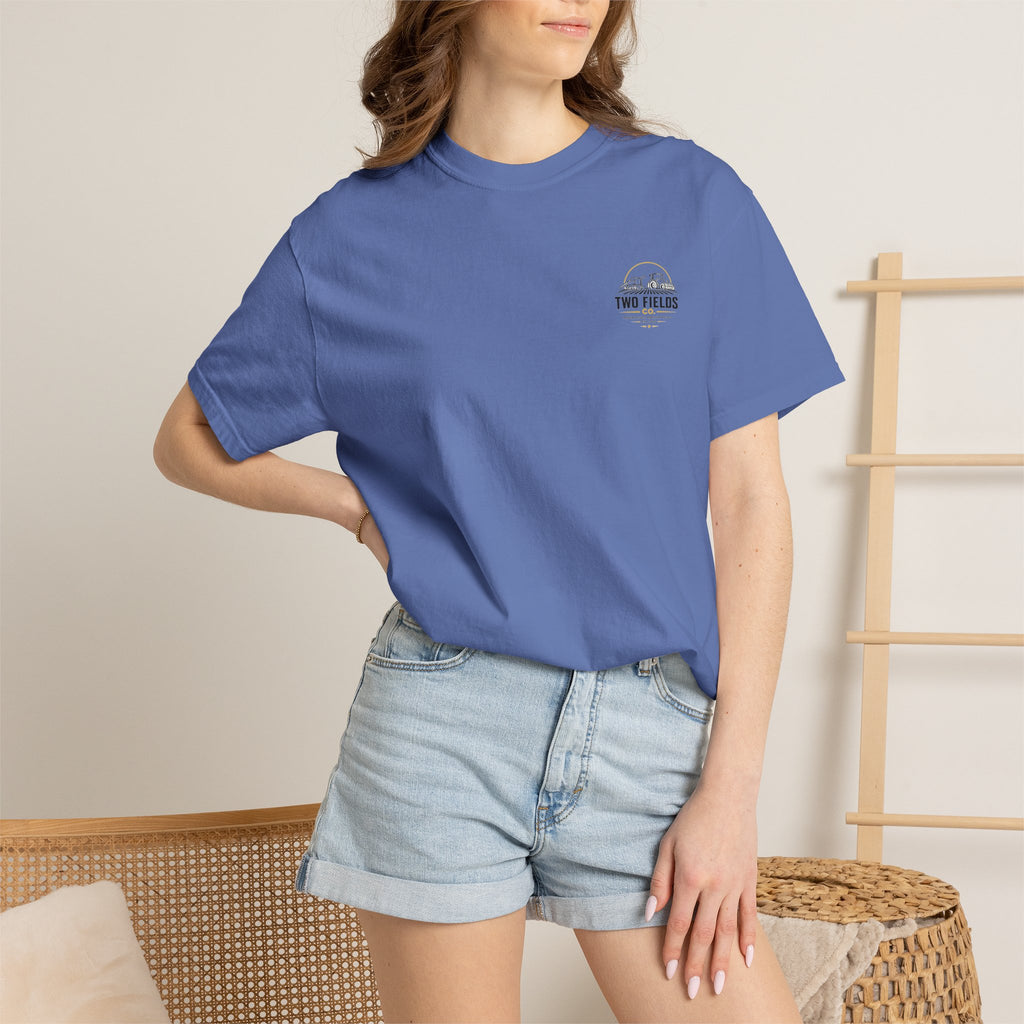 Blue crew-neck T-shirt worn by model, with small Two Fields Co logo on chest.
