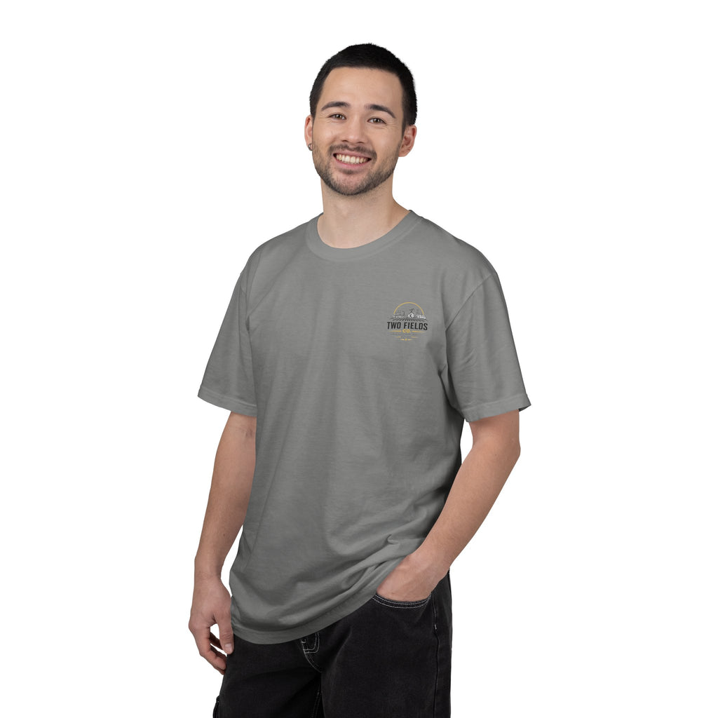 Grey crewneck T-shirt on model with small Two Fields Co. chest tractor logo