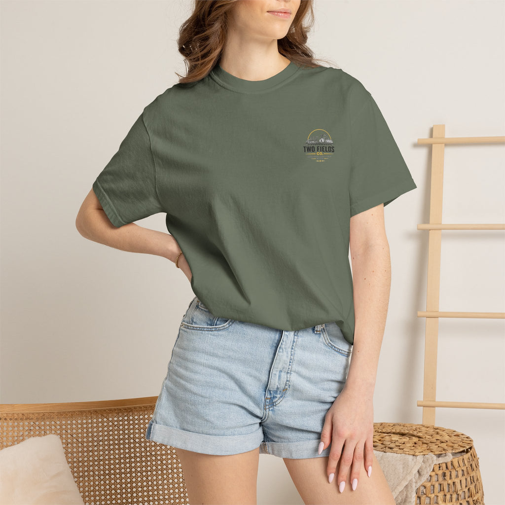 Olive green T-shirt with chest logo worn by model