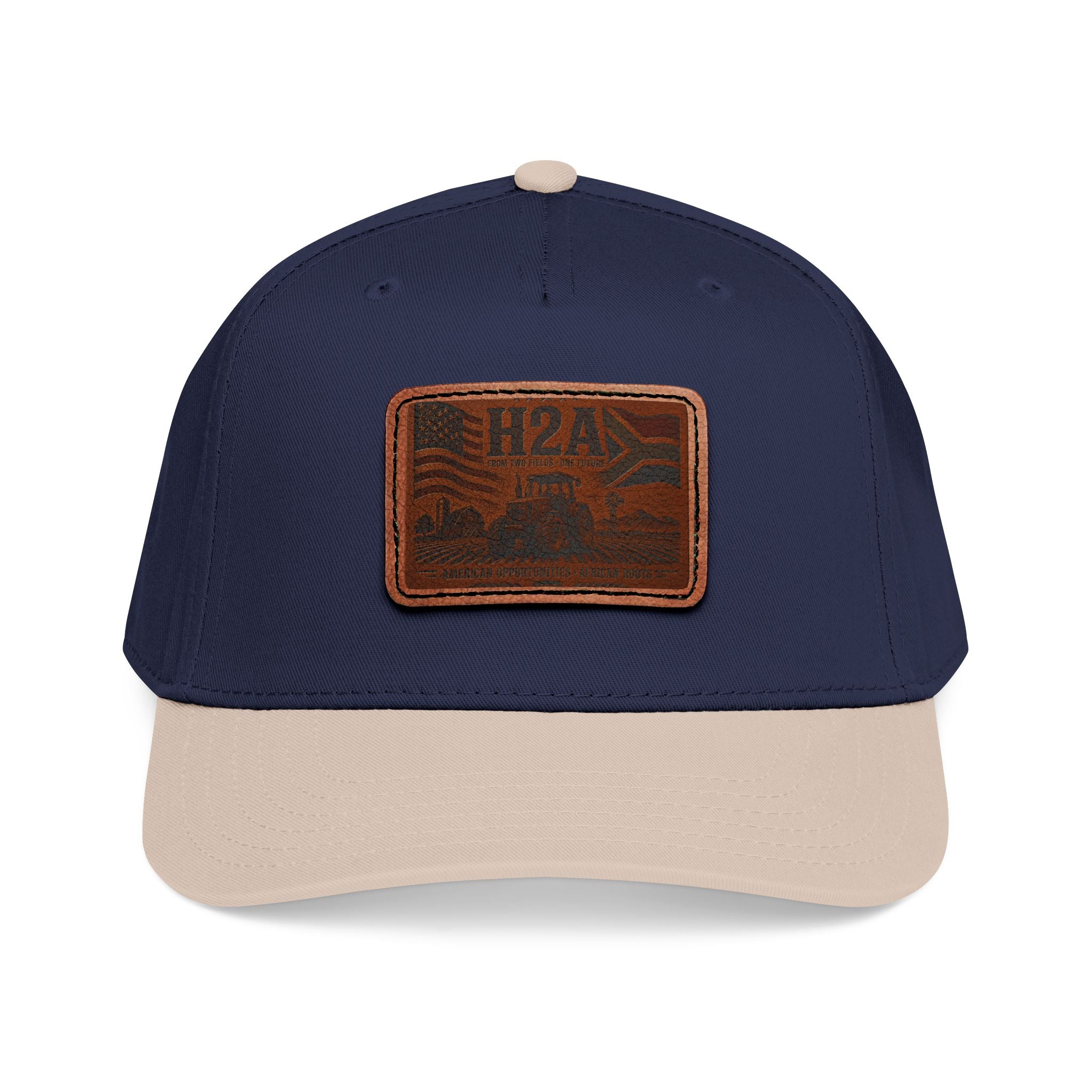 Navy and tan baseball cap with rectangular vintage logo leather patch on front