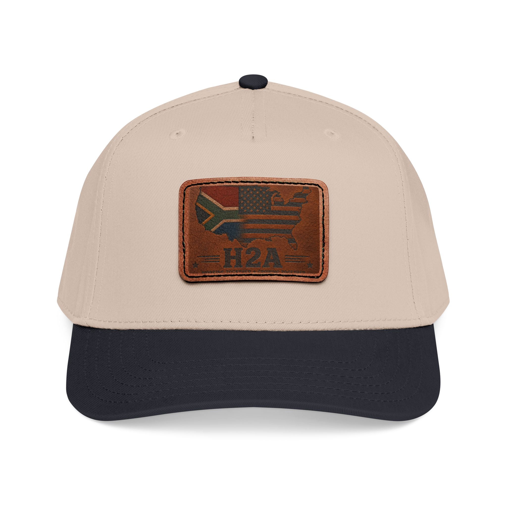 Two-tone baseball cap with rectangular leather patch and H2A flag design, beige and dark blue