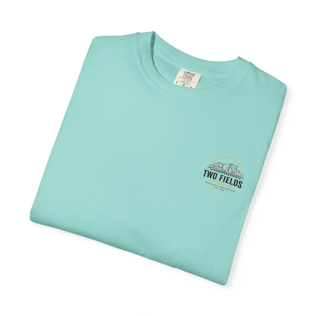 Folded mint green T-shirt with small Two Fields chest logo patch