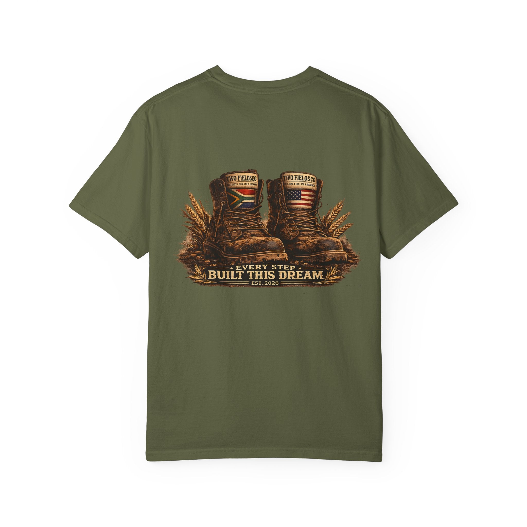 Olive green graphic T-shirt with brown work boots and gold “Every Step Built This Dream”