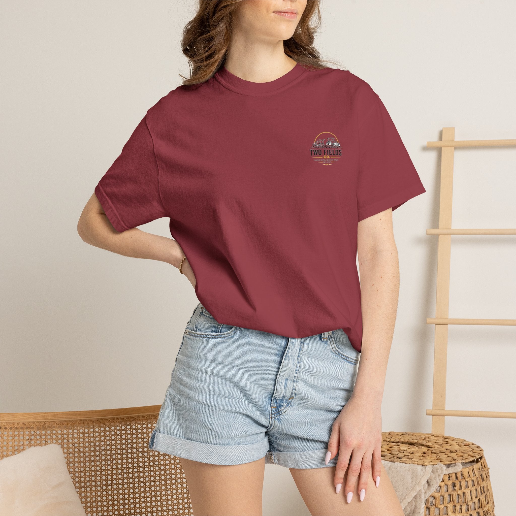 Maroon crew neck T-shirt with small chest Twin Fields logo on model.