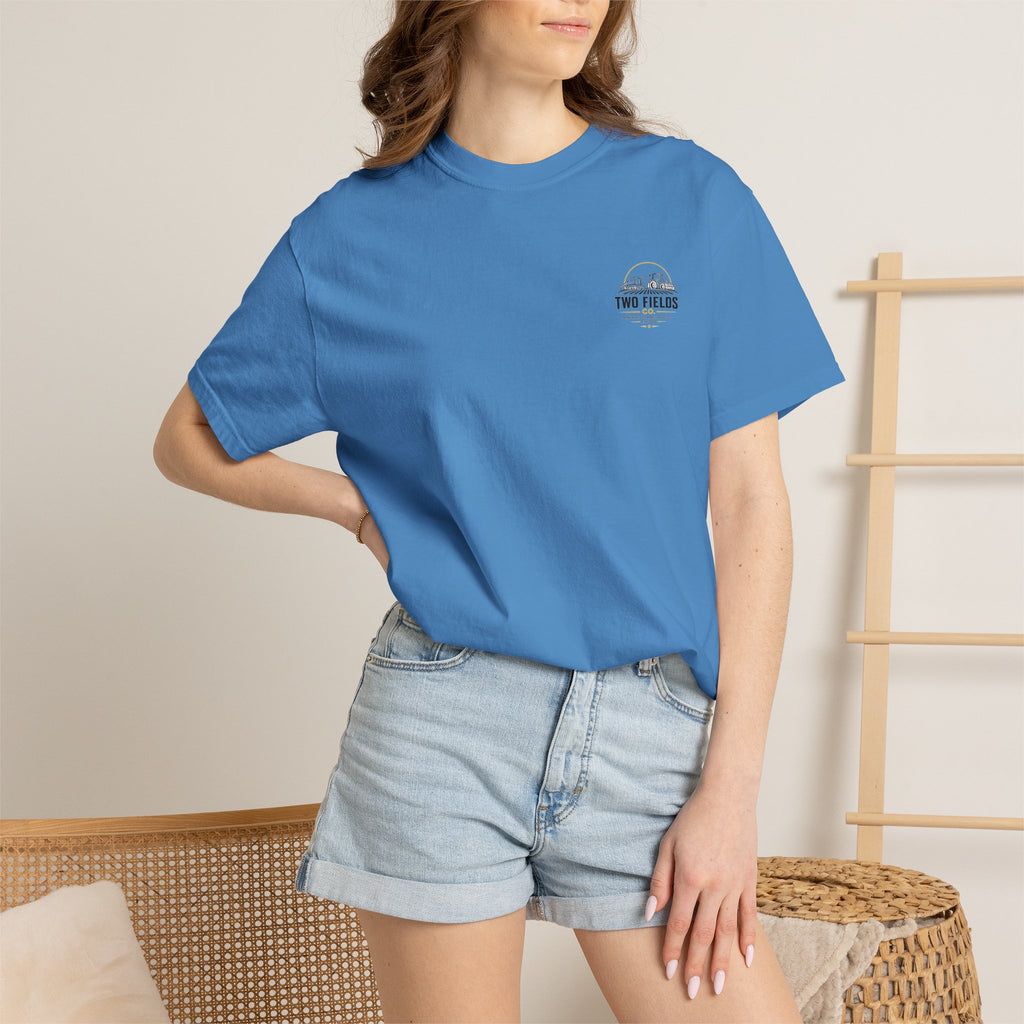 Blue crew-neck T-shirt worn by model, with small Two Fields Co logo on chest.
