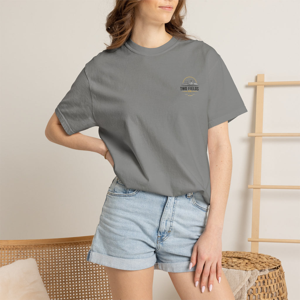 Gray graphic T-shirt on model, chest shows small Two Fields logo