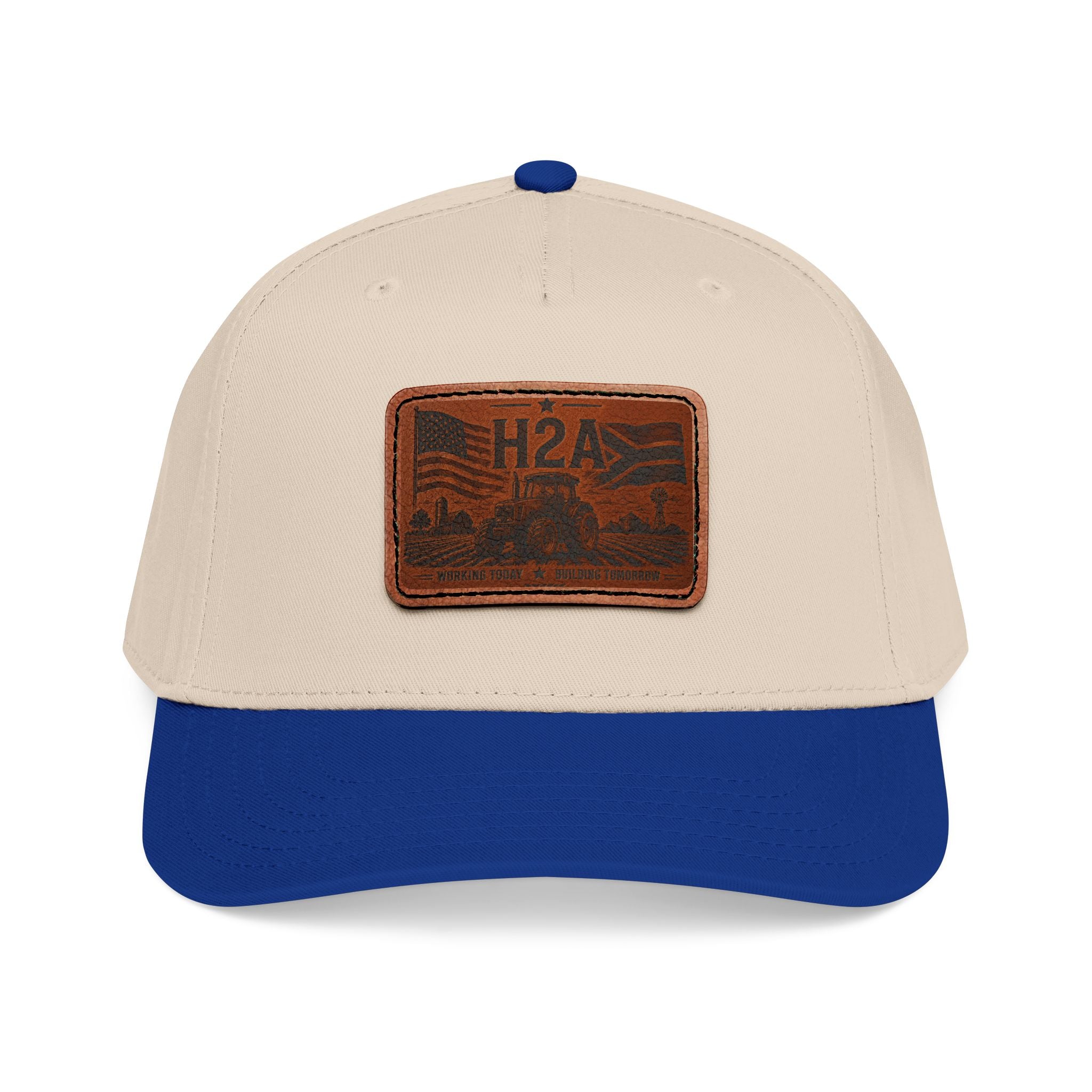 Two-tone baseball cap with rectangle H2A leather patch; beige crown and royal blue brim.