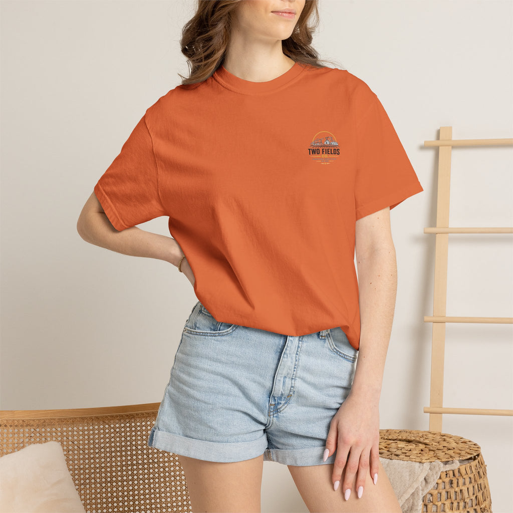 Orange crewneck t-shirt with small TWO FIELDS logo on chest, worn