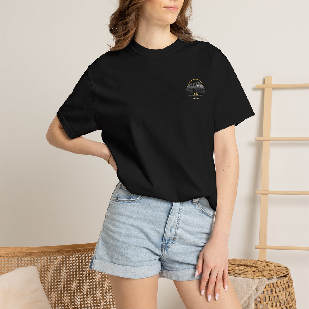 Black T-shirt with small chest logo, crew neck, short sleeves worn.
