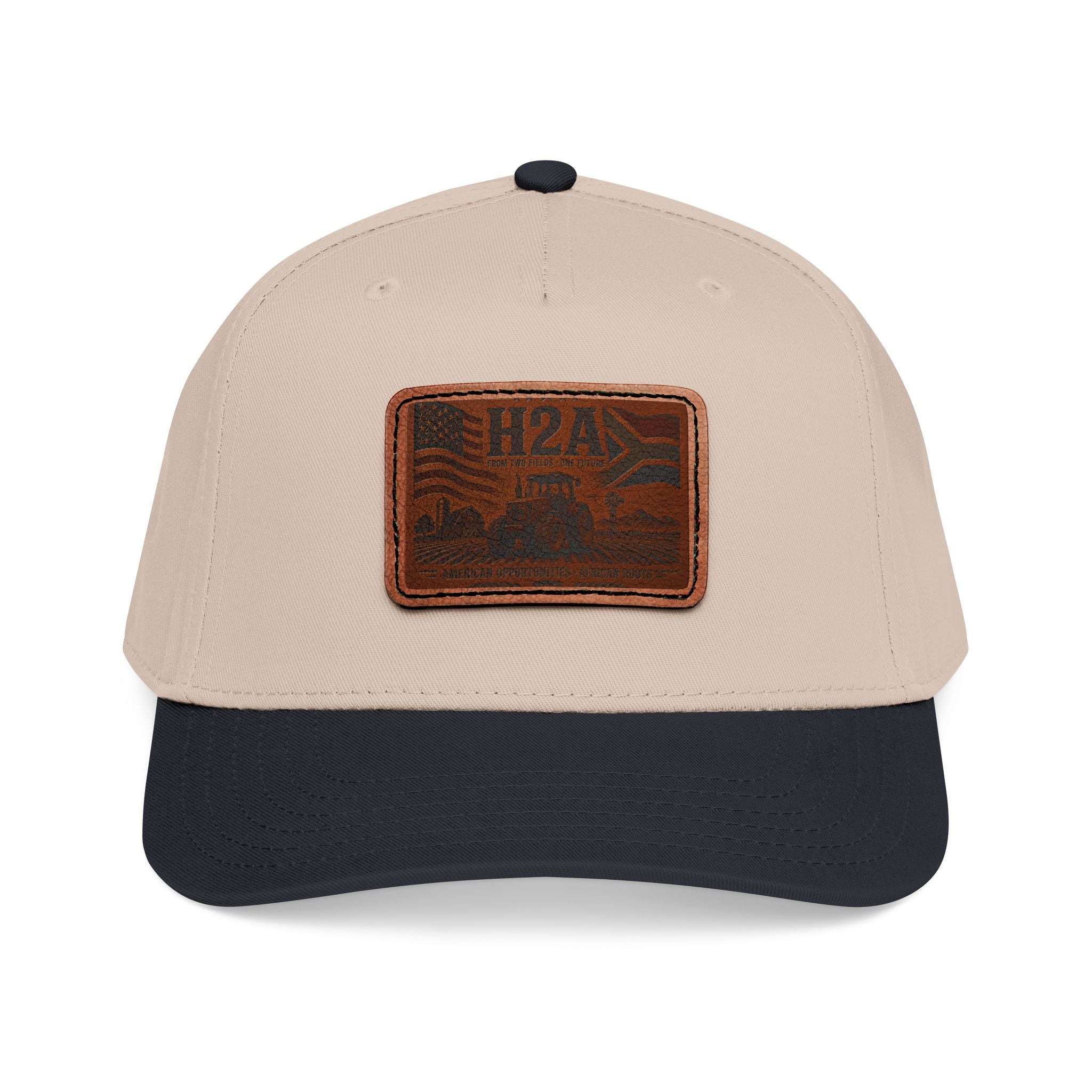 Tan and navy baseball cap with rectangular vintage logo leather patch on front
