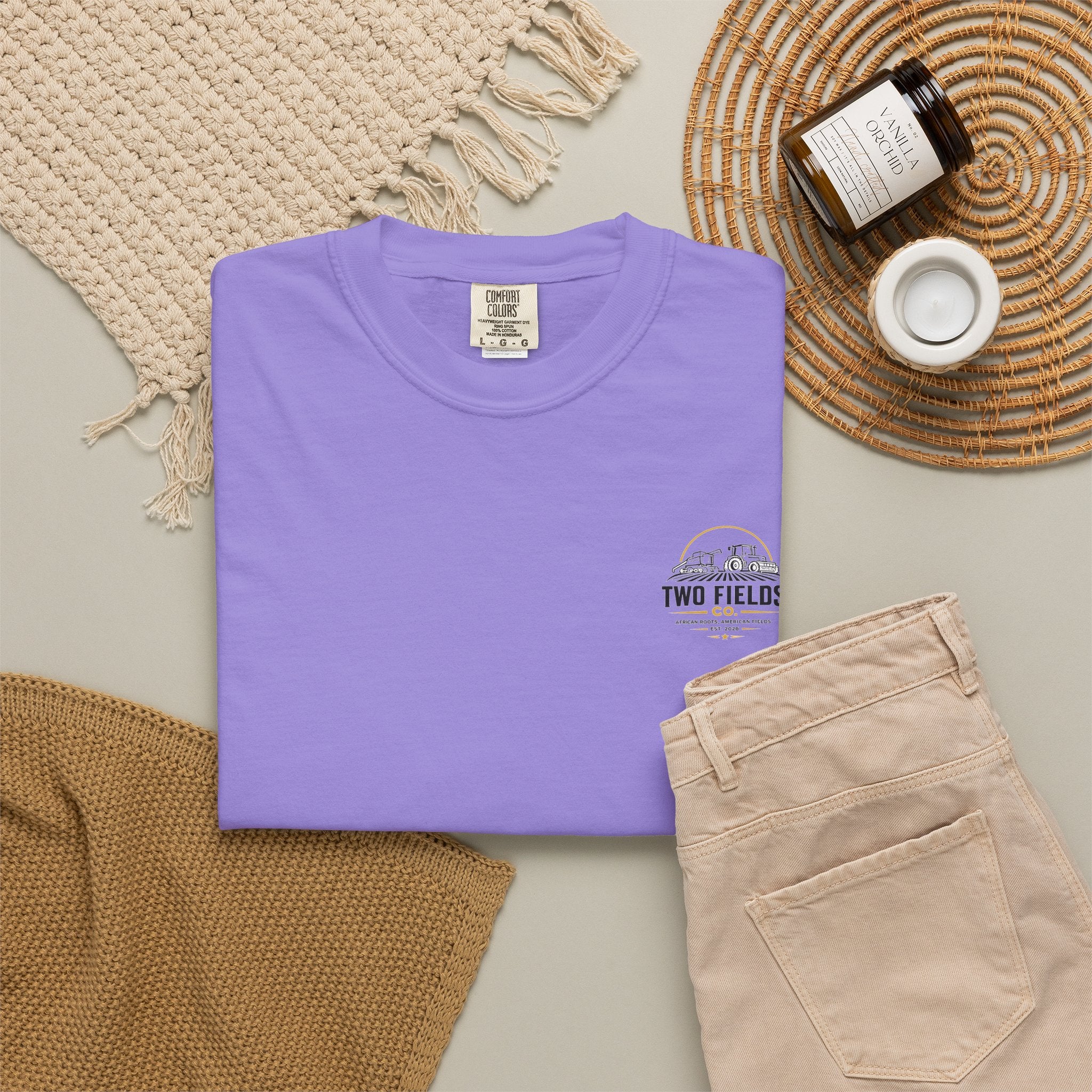 Men's purple crew-neck T-shirt with small right-chest 'Two Fields Co.' tractor mark