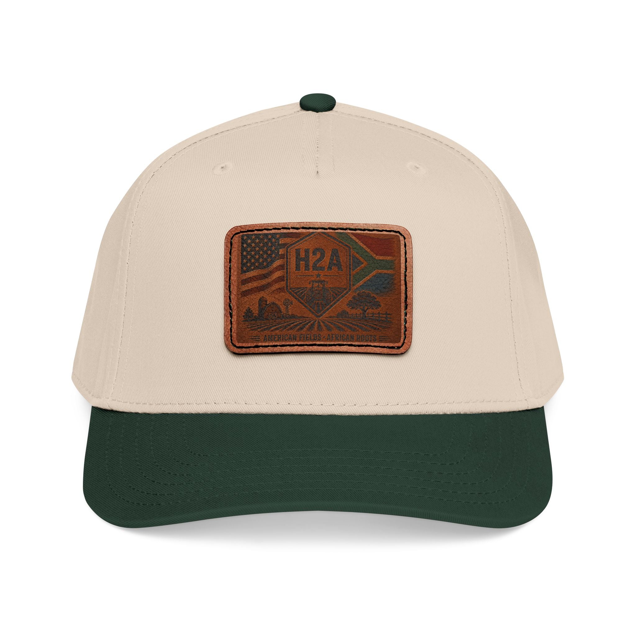Two-tone baseball cap, tan crown with dark green brim, rectangular H2A patch