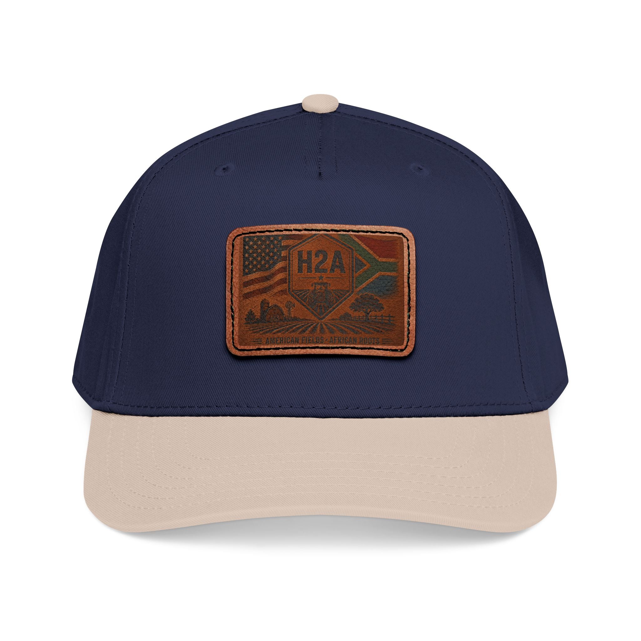 Navy baseball cap with beige brim and rectangular H2A flag leather patch.