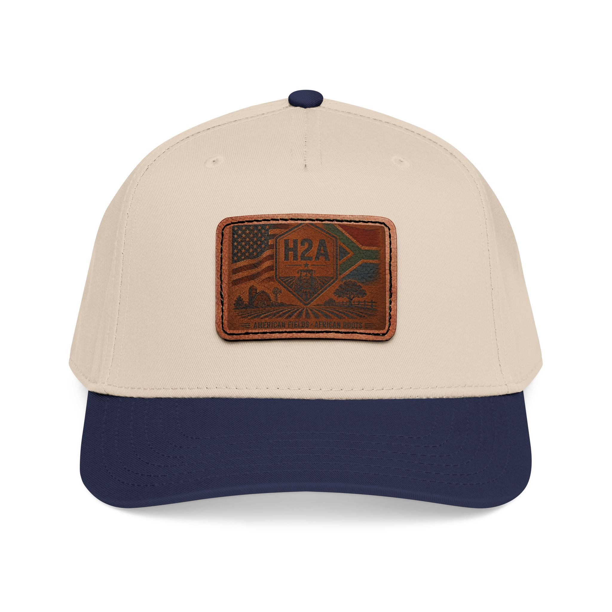 Two-tone baseball cap, tan crown with navy brim and rectangular H2A patch