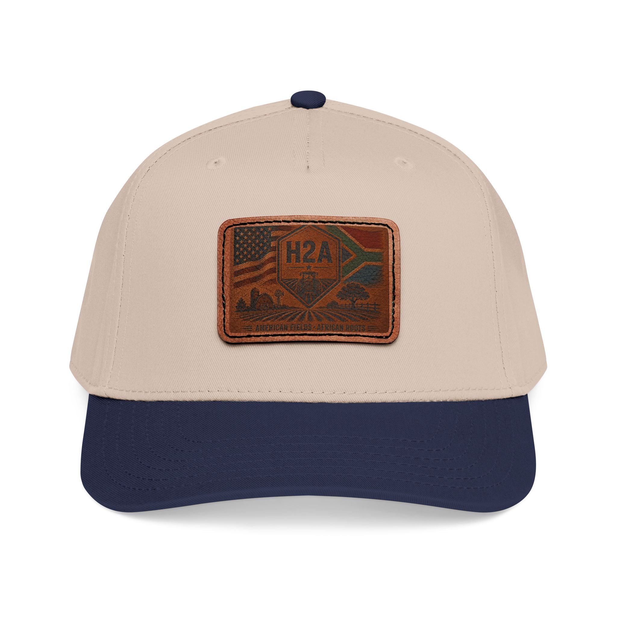Beige baseball cap with navy brim and rectangular H2A flag leather patch.