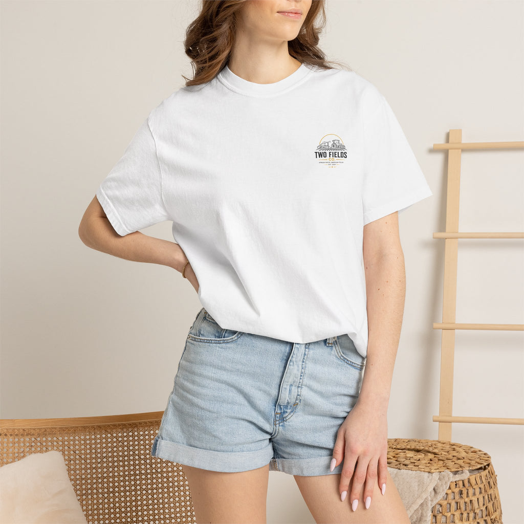 White graphic t-shirt with small chest logo patch detail