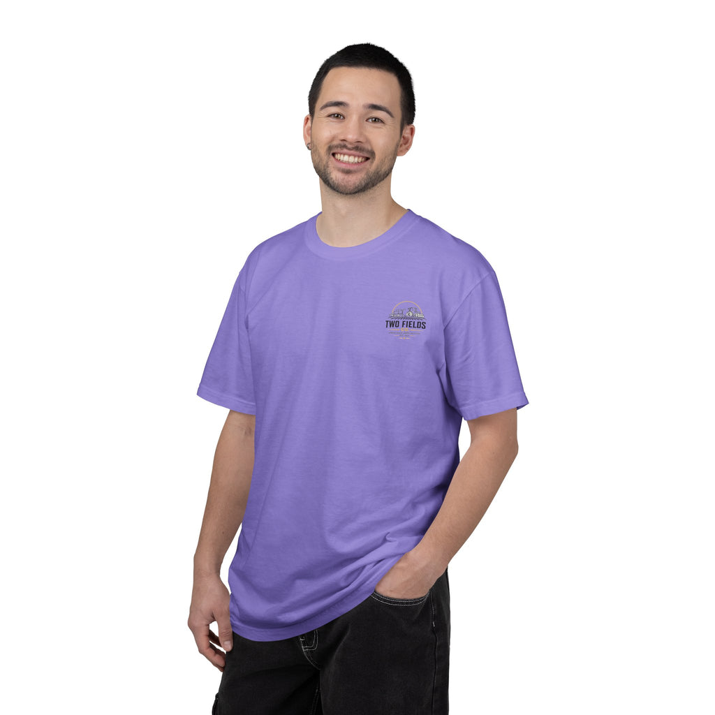 Men's purple crew-neck T-shirt on model with small right-chest 'Two Fields Co.' logo