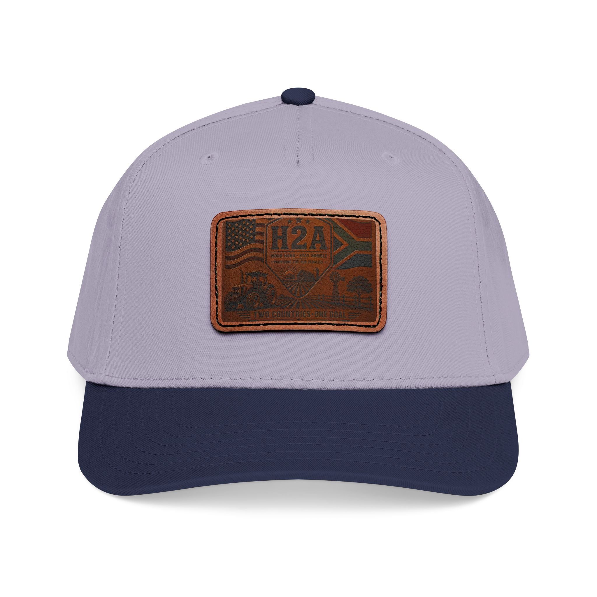Mid-profile baseball cap, light gray crown and navy brim, rectangular leather flag patch