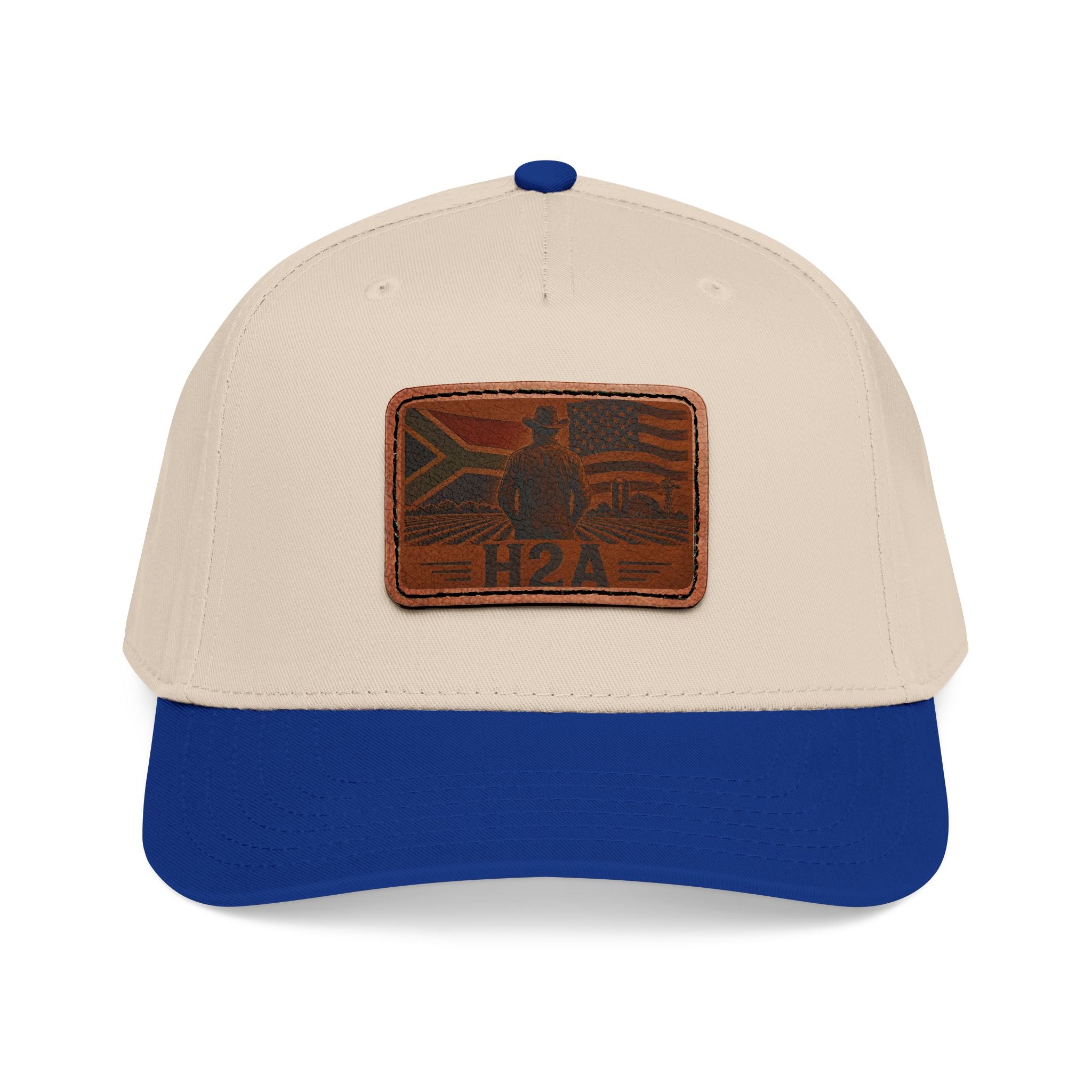 Two-tone baseball cap with cream crown, navy brim, and rectangular H2A leather patch.