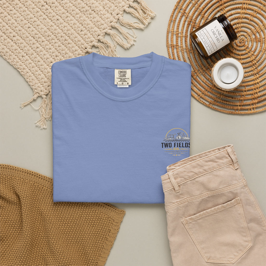 Light blue laid-flat crewneck T-shirt with small Two Fields logo on left chest