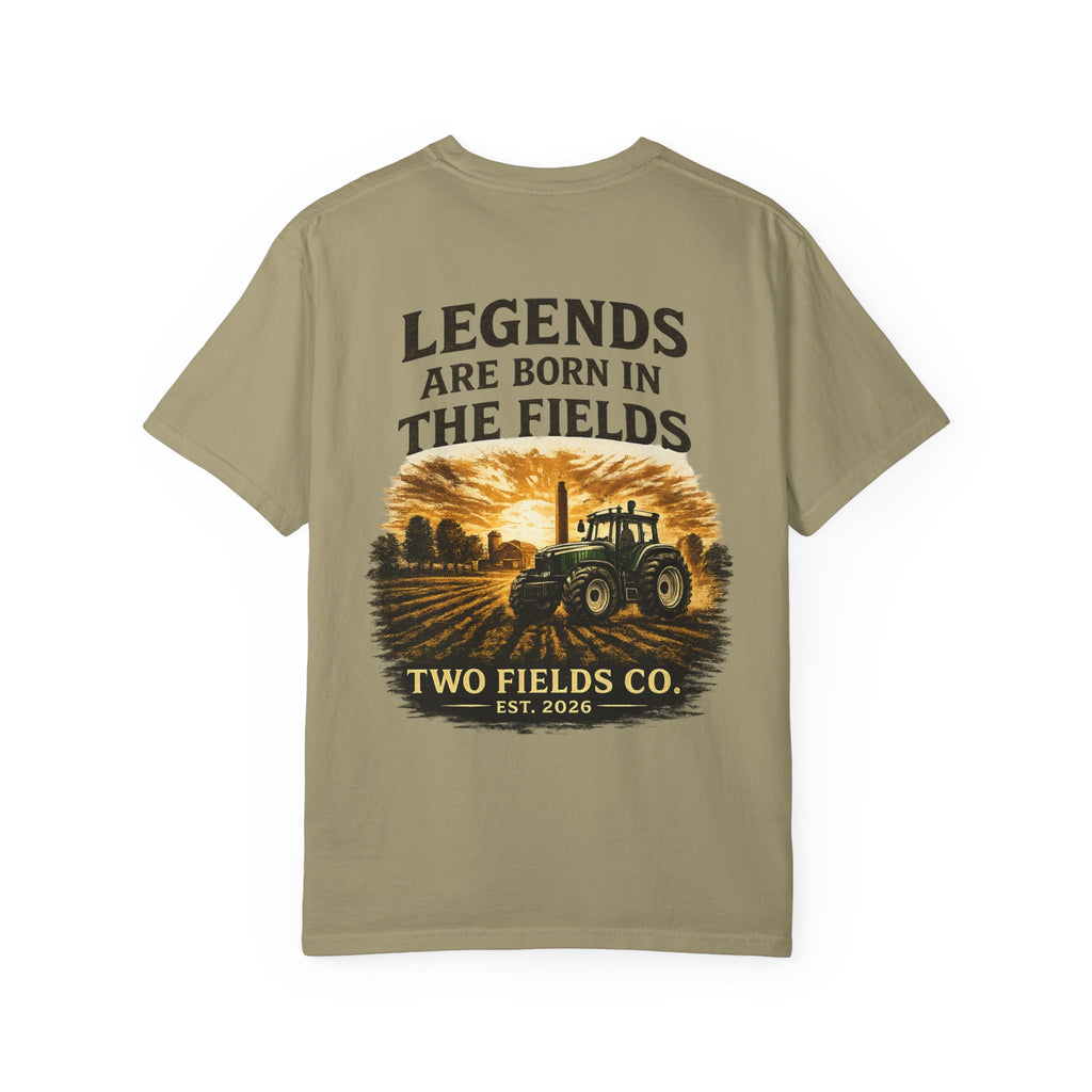 Sage green graphic farm tractor T-shirt with 'Legends Are Born in the Fields' text.