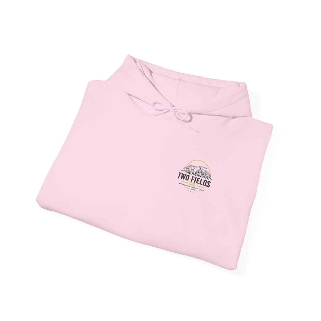Light pink scenic graphic hoodie, folded with front pouch and small chest logo patch