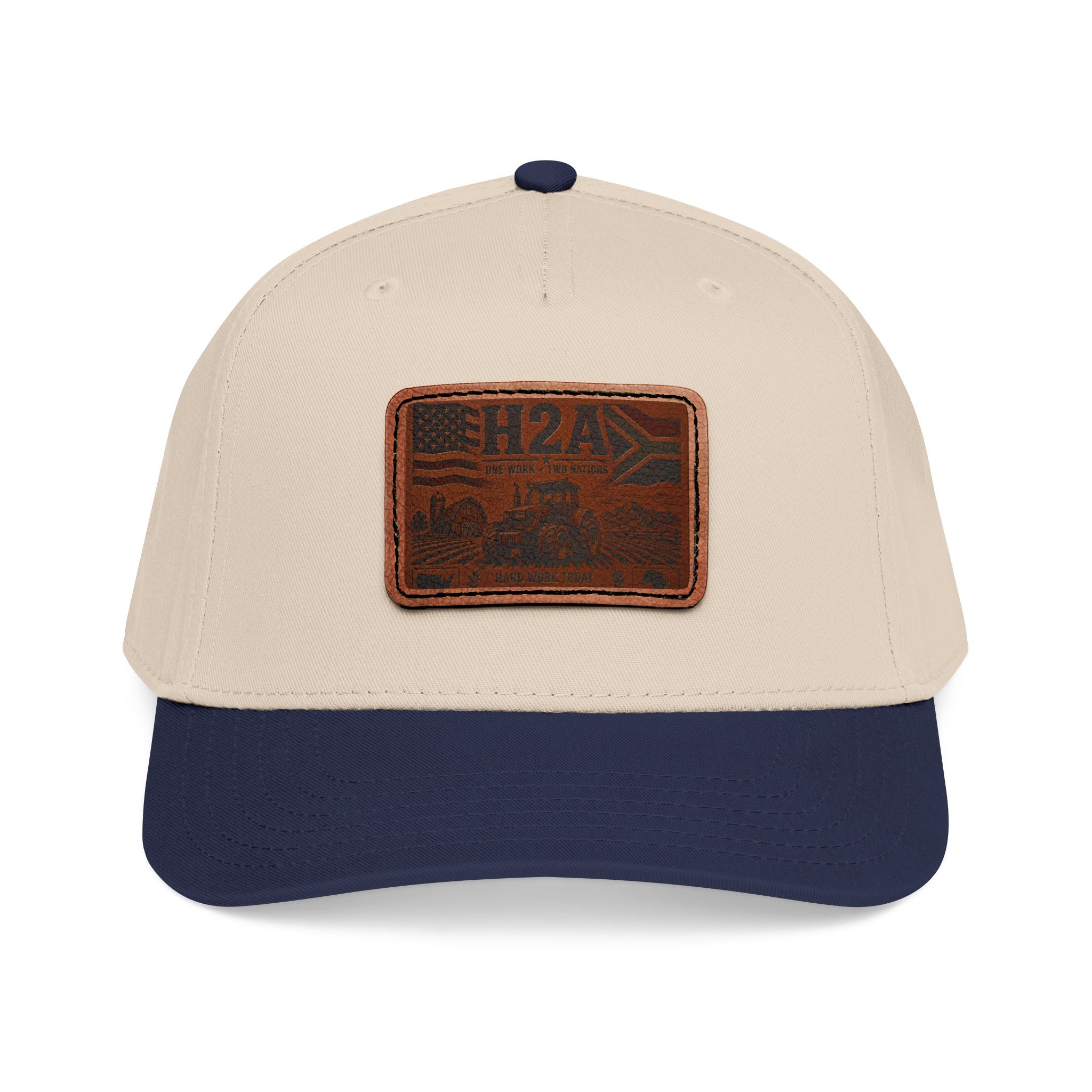 Two-tone baseball cap with rectangular H2A leather truck patch; light cream crown, navy brim.