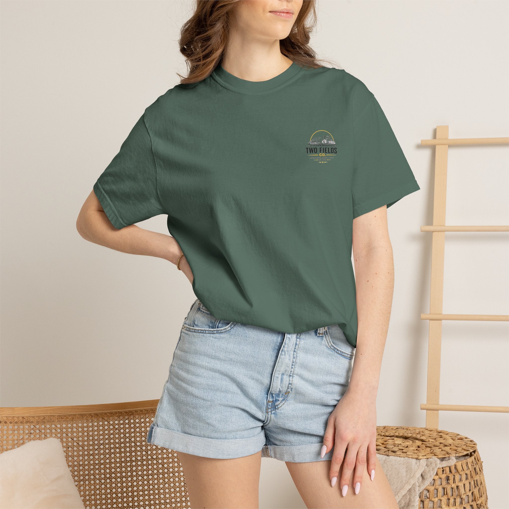 Green t-shirt worn by model with small “Two Fields Co.” chest logo