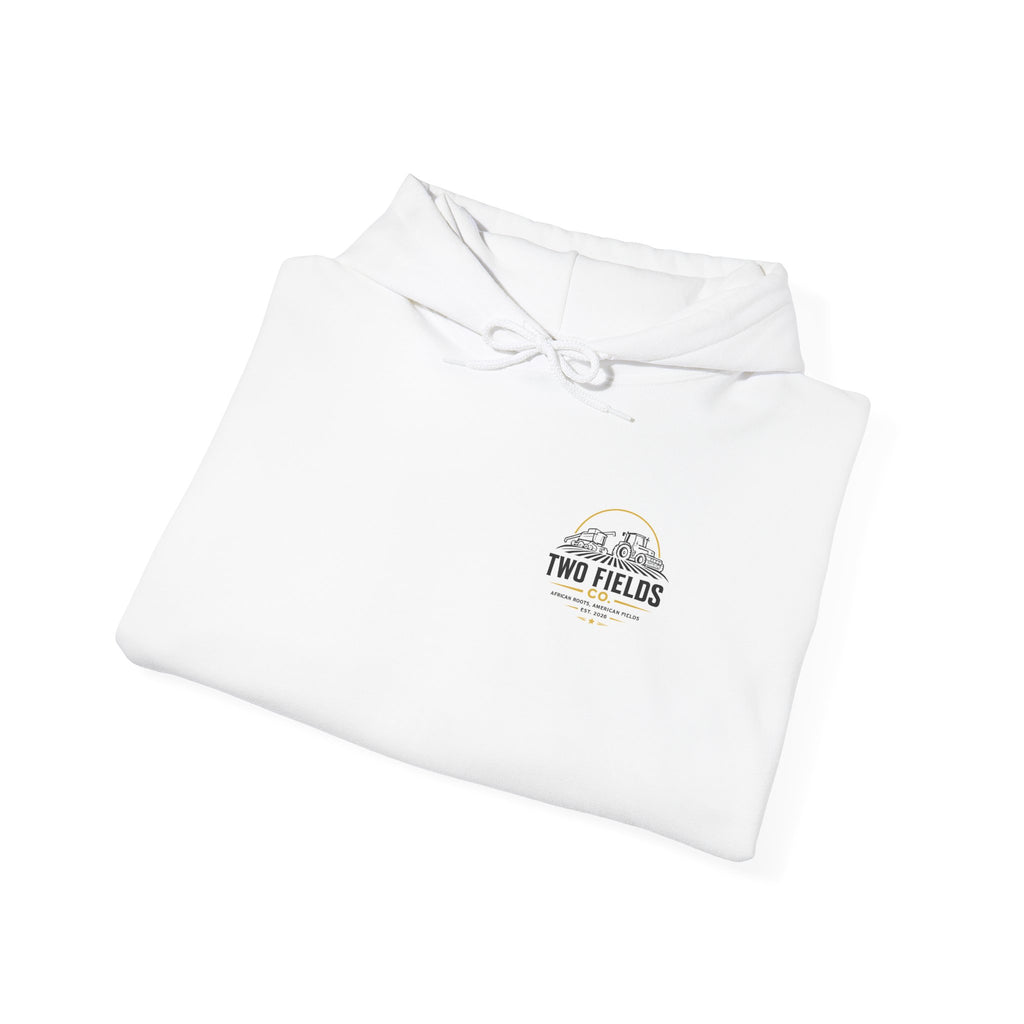 Folded white hoodie with hood and small Two Fields chest logo.