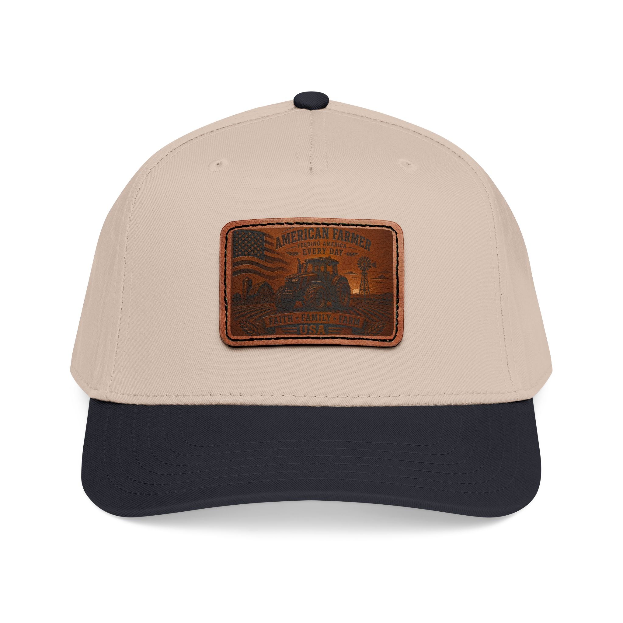 Leather patch baseball cap with tan crown, dark navy brim, and stitched leather badge.