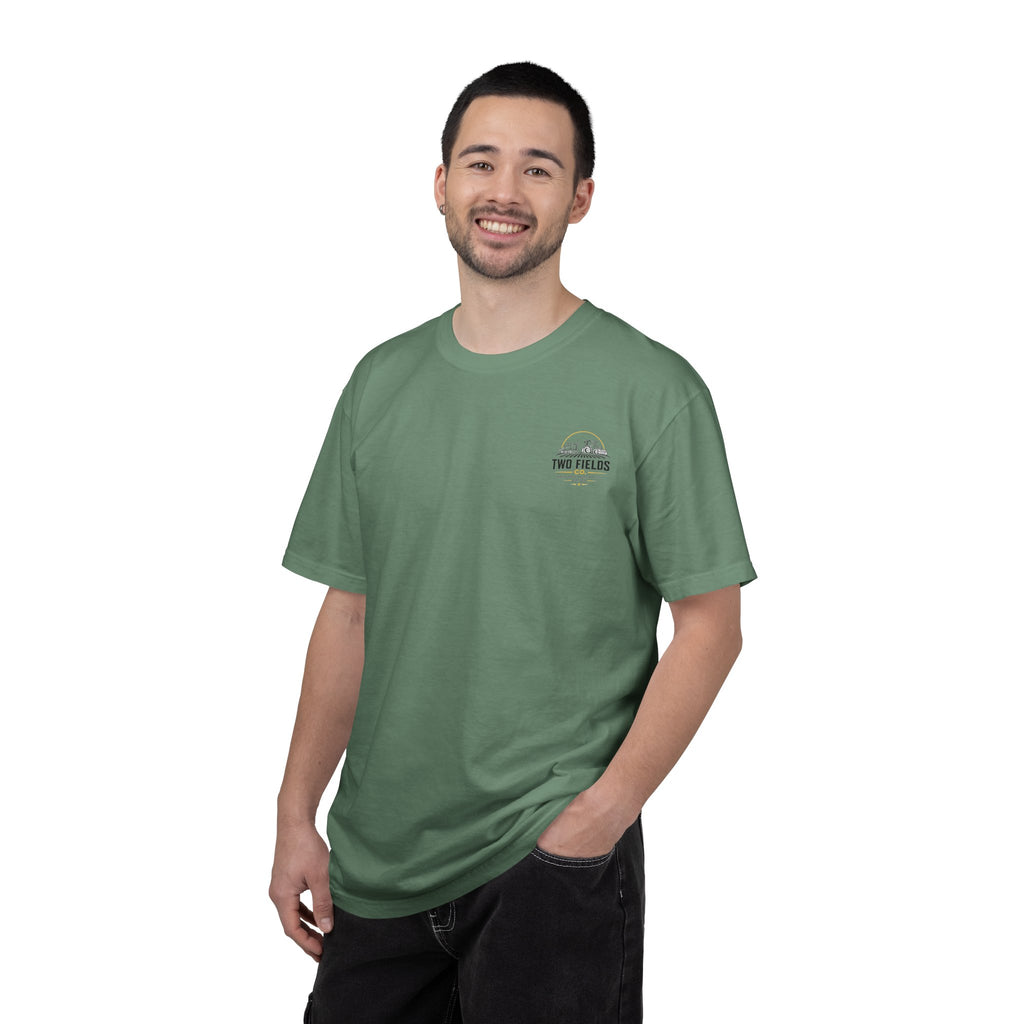 Green crewneck T-shirt with small circular Two Fields logo on the chest worn by a man