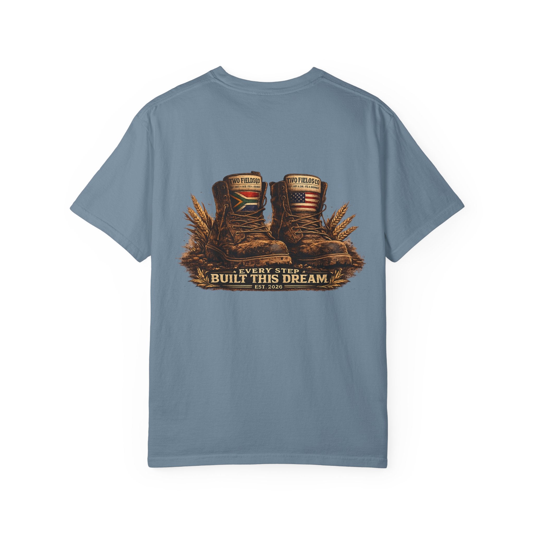 Slate blue crew neck T-shirt with boots and “Every Step Built This Dream” graphic.