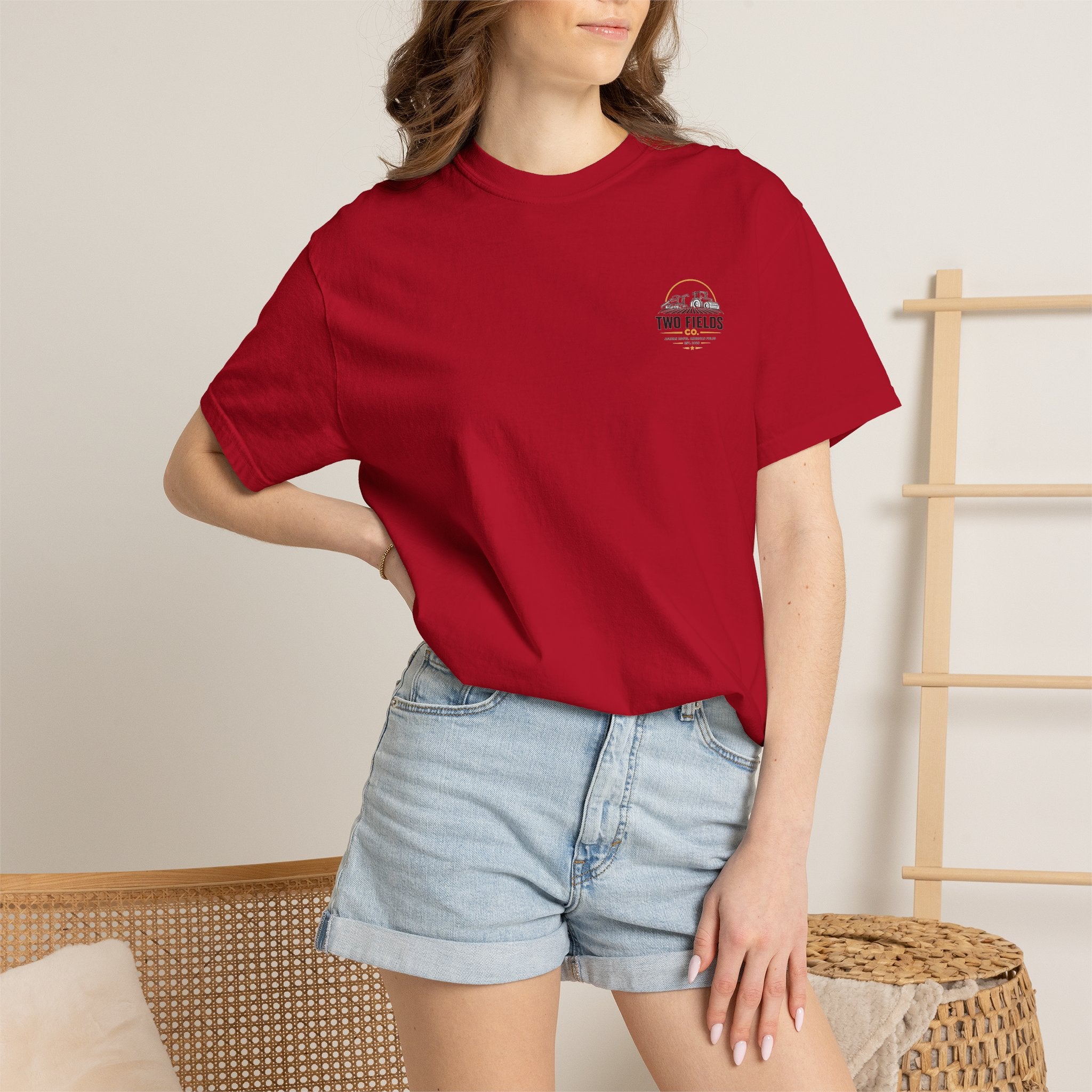 Red T-shirt with small circular chest logo on model