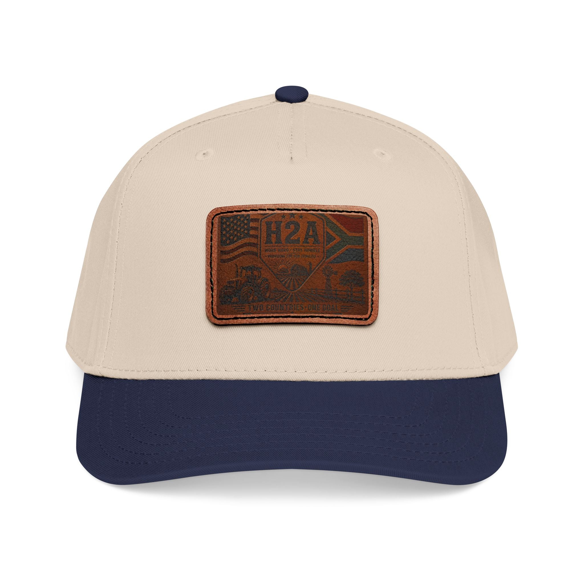 Mid-profile baseball cap, beige crown and navy brim, rectangular leather flag patch