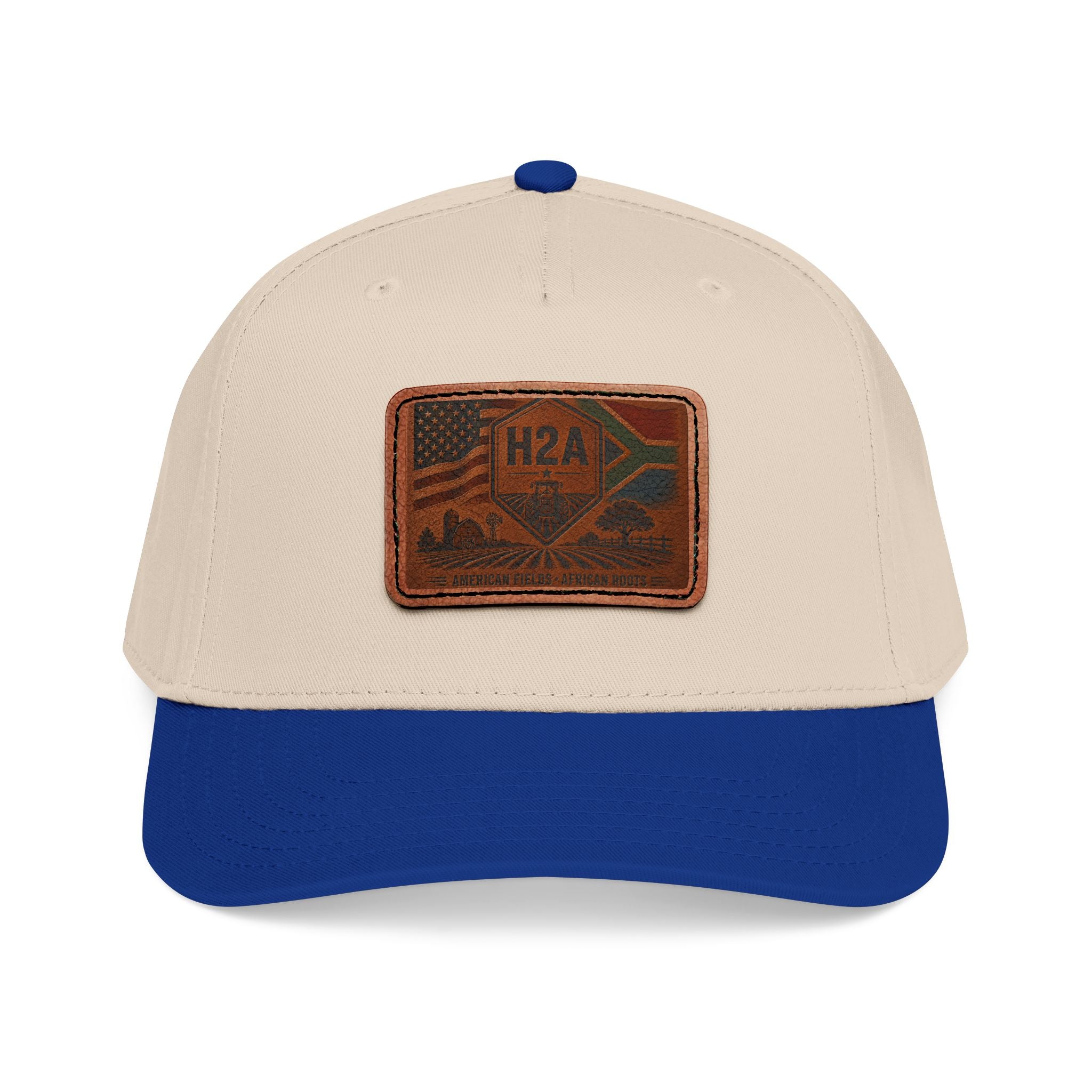 Two-tone baseball cap, tan crown with royal blue brim and rectangular H2A patch