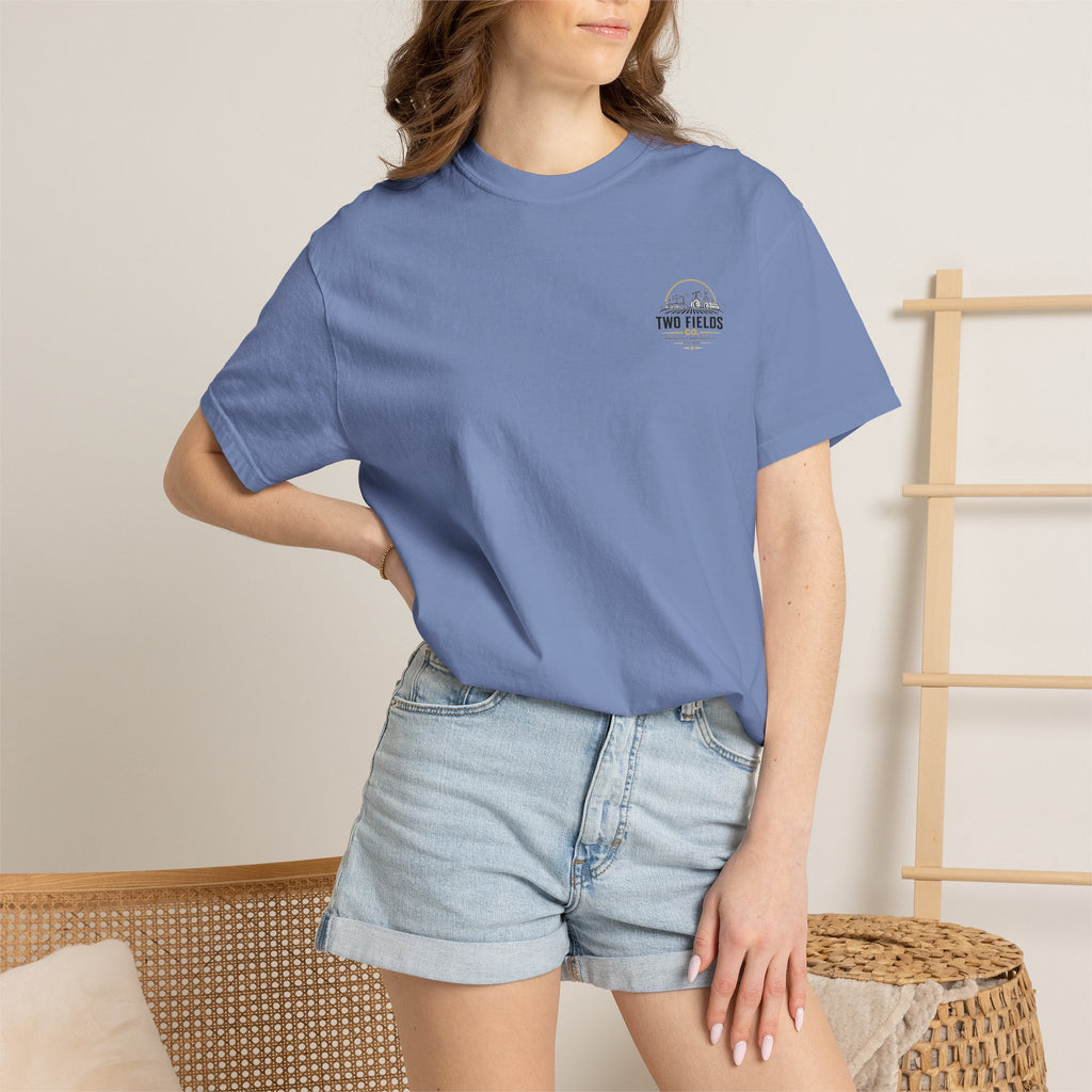 Blue vintage farm tractor logo T-shirt on model, crew neck short sleeves