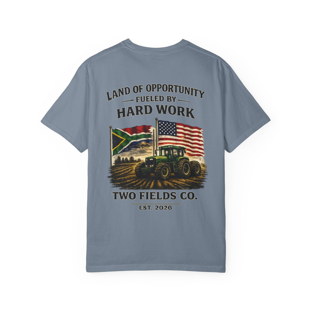 Blue short-sleeve T-shirt with tractor scene and "Two Fields Co." graphic on back
