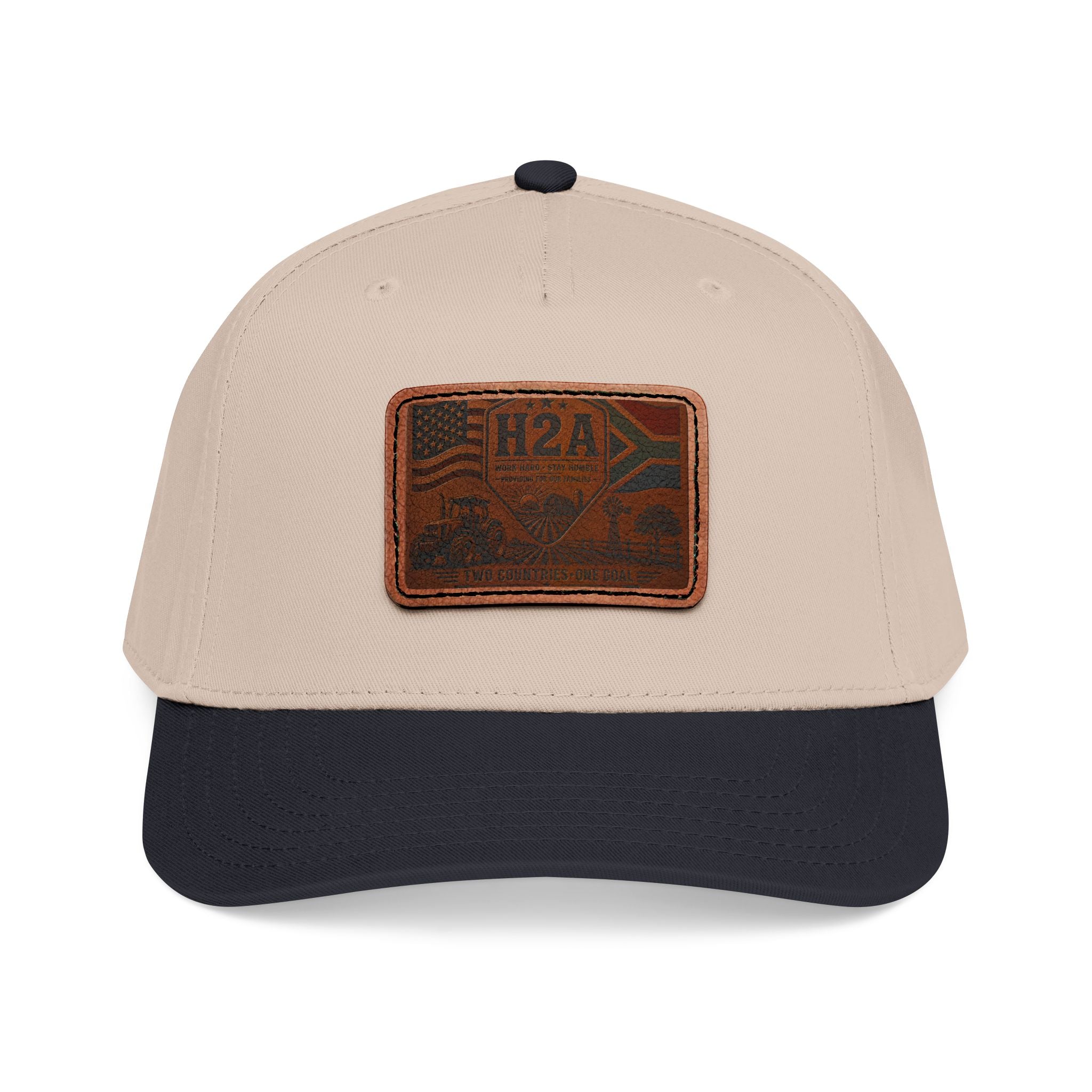 Beige baseball cap with dark blue brim and rectangular leather H2A flag patch