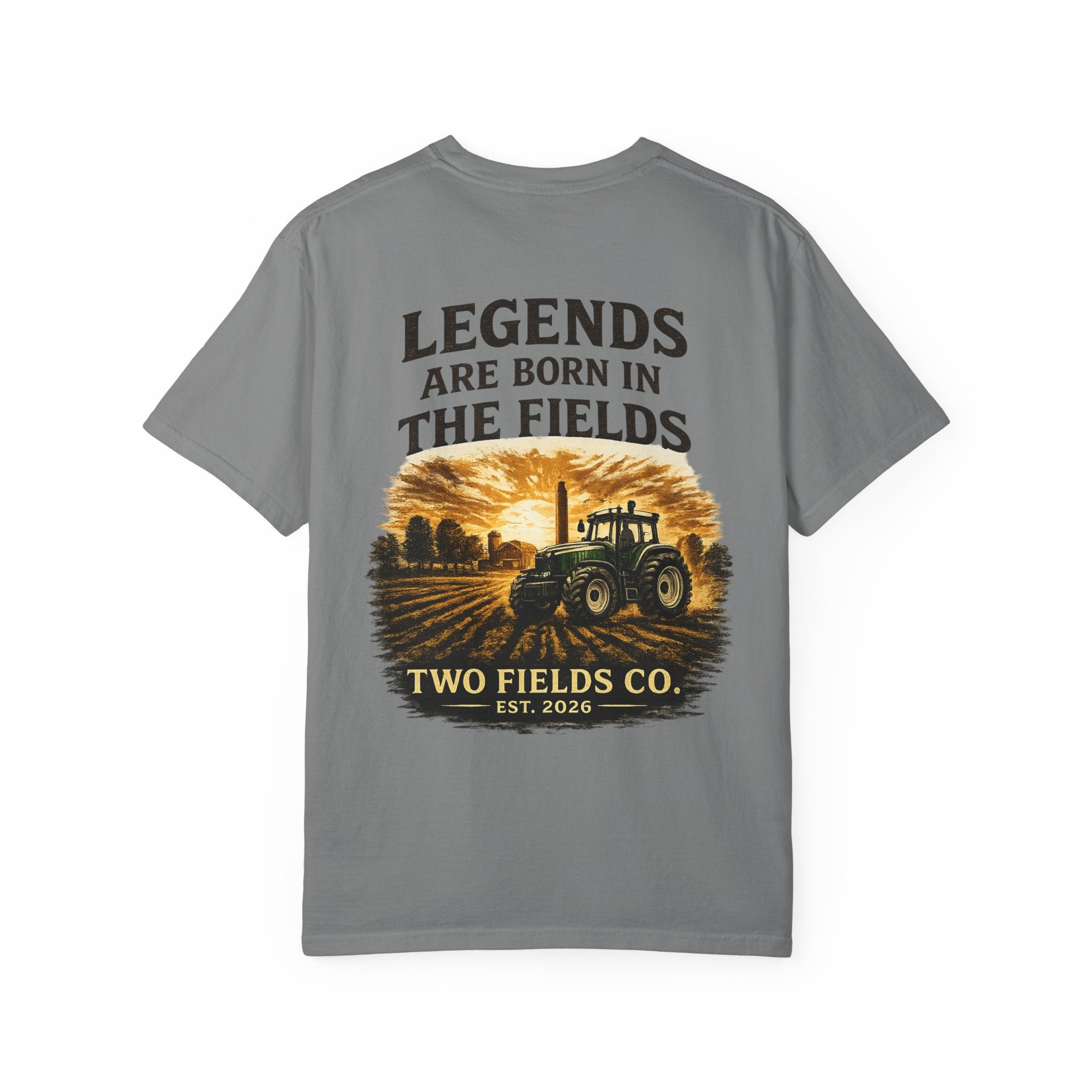 Dark gray front graphic farm tractor T-shirt with 'Legends Are Born in the Fields' print.