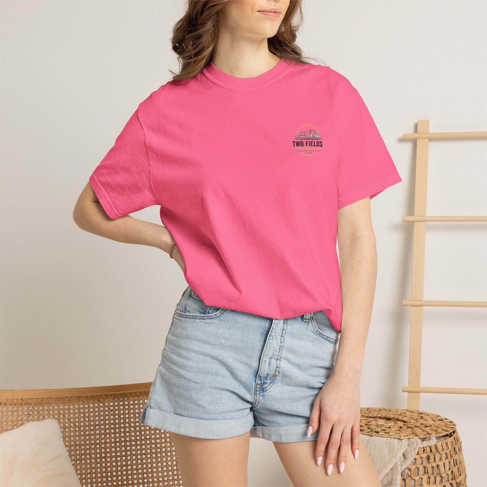 Bright pink crew-neck T-shirt with small Two Fields Co. chest logo