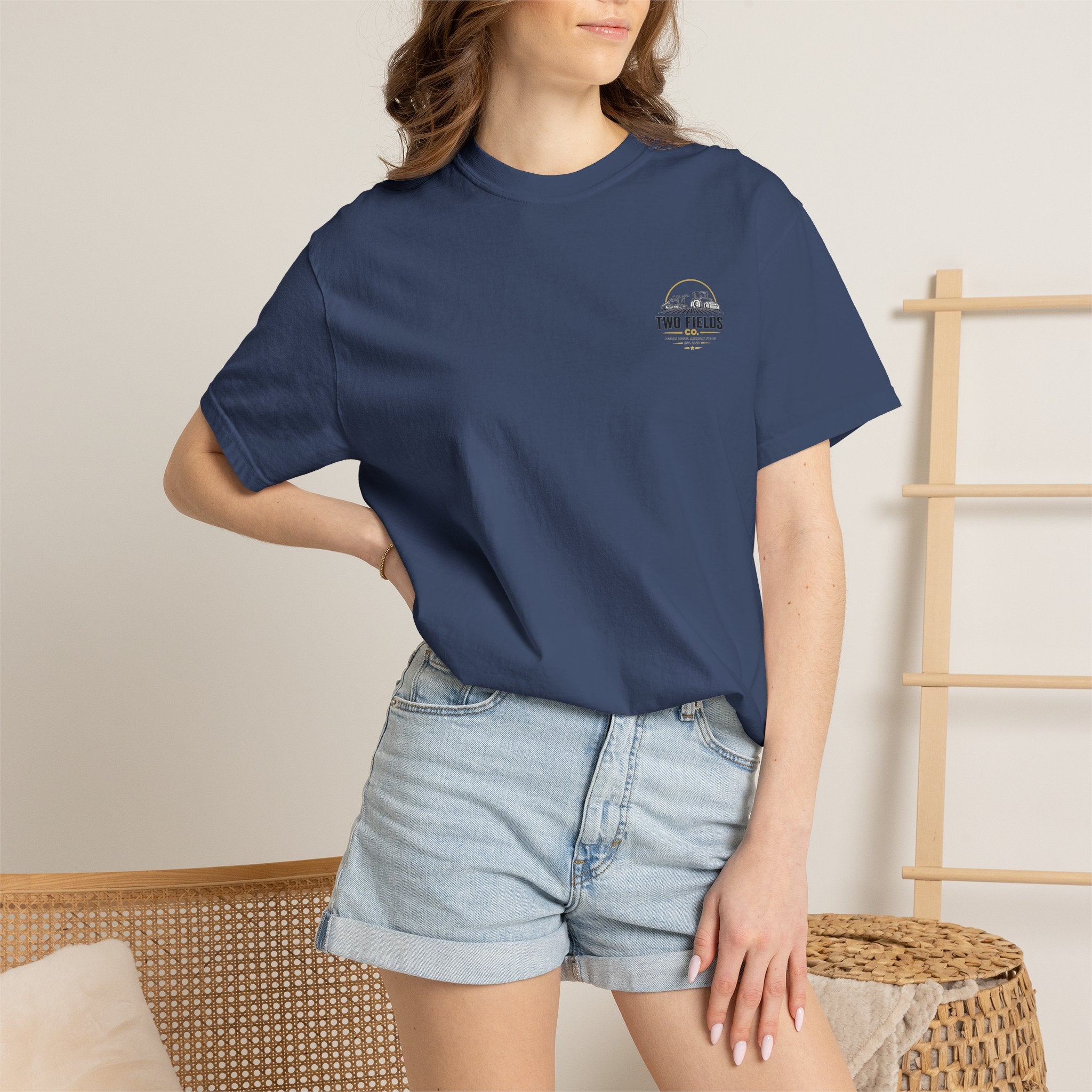 Dark navy T-shirt on model with small Two Fields Co logo on the chest