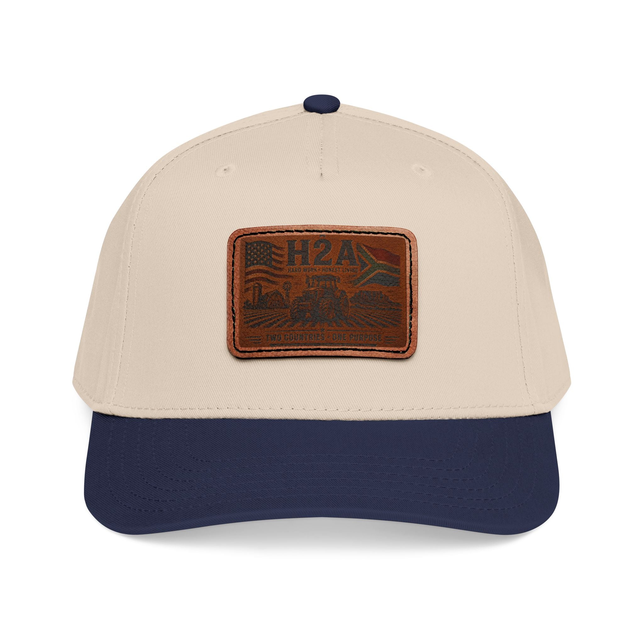 Two-tone baseball cap with rectangular H2A patch, cream crown and navy brim.