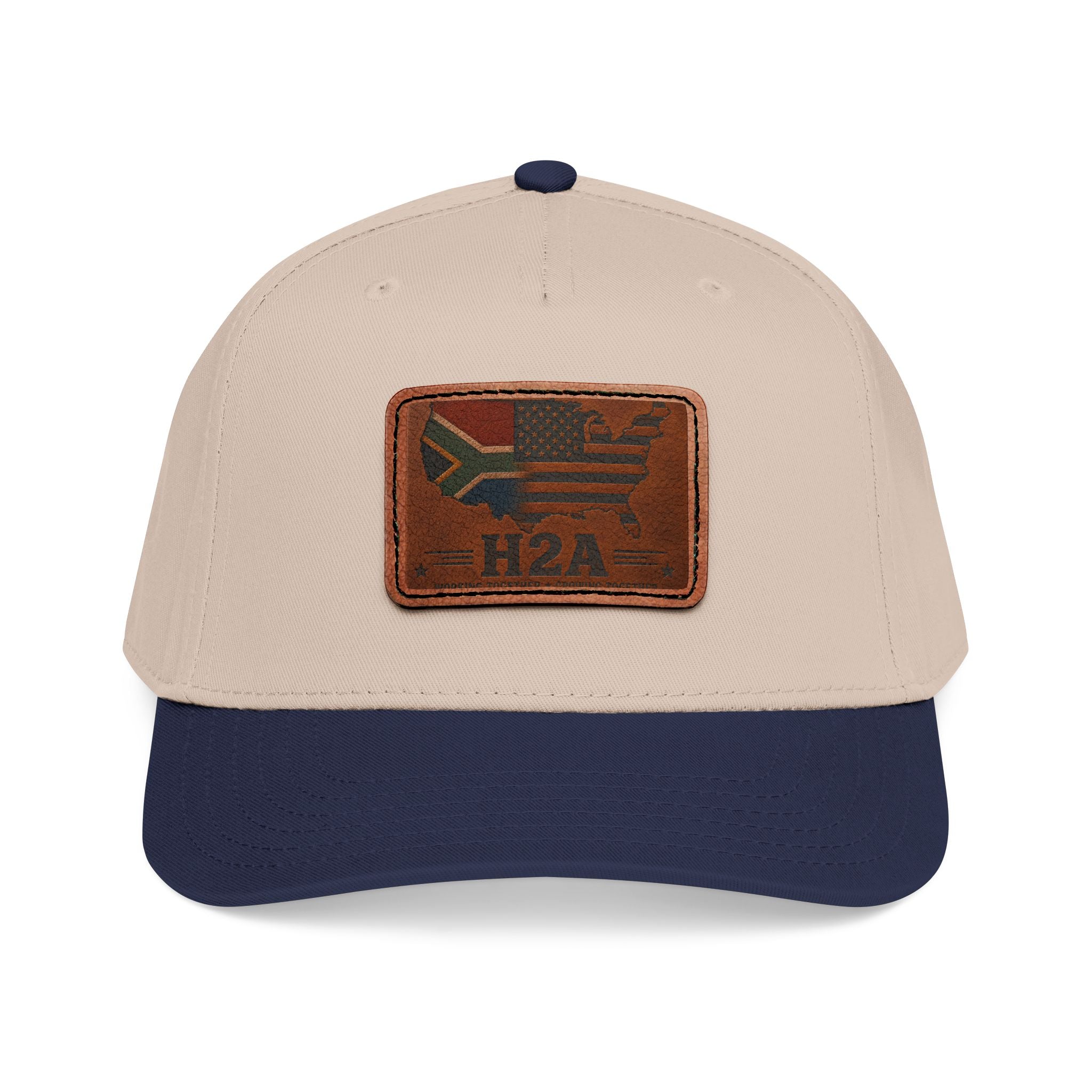 Two-tone baseball cap with rectangular leather patch and H2A flag design, beige and dark blue