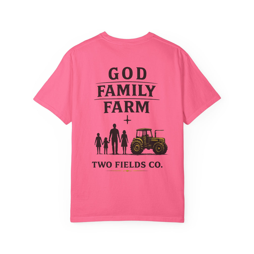 Pink crewneck T-shirt with large God Family Farm text, family silhouettes, and tractor graphic