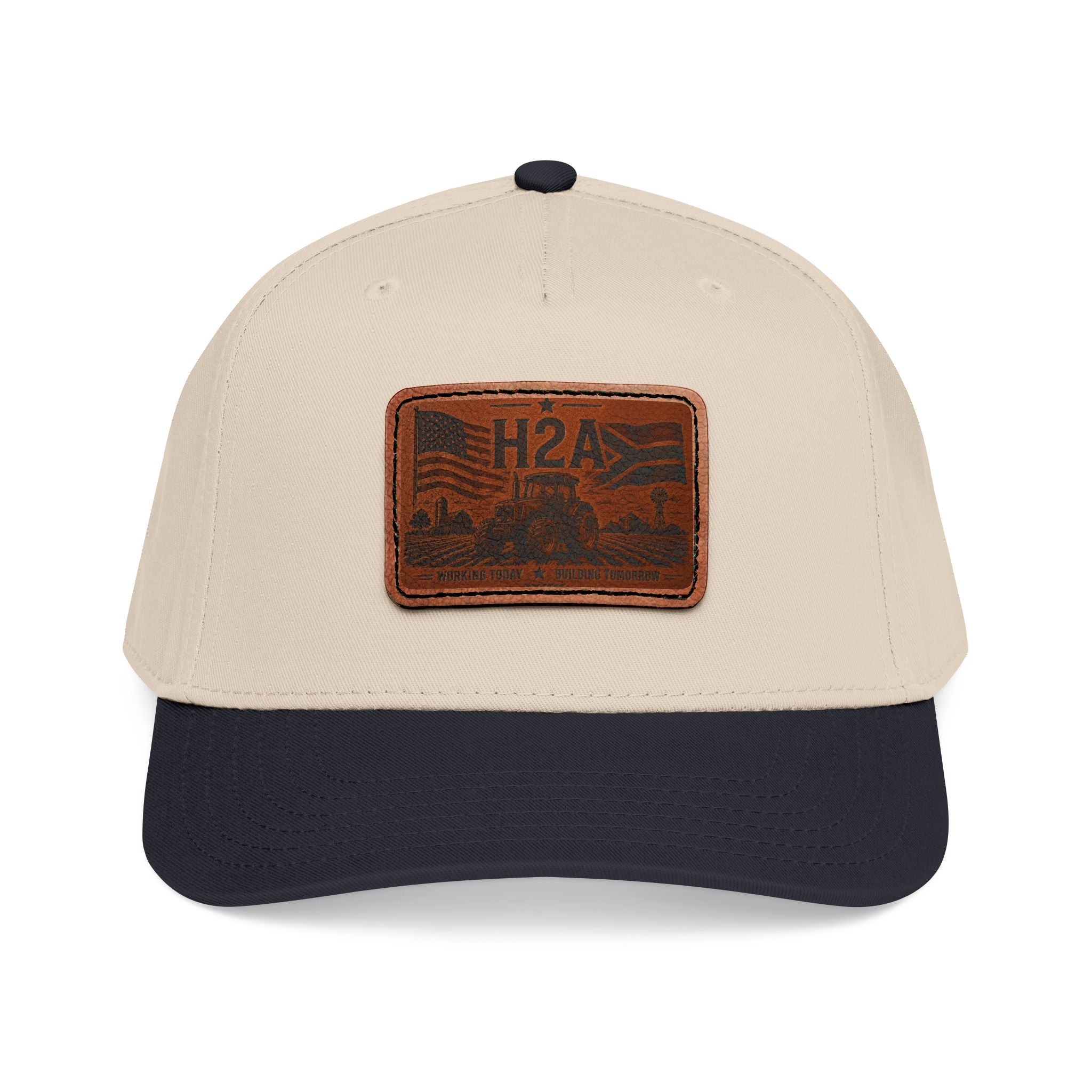 Beige and dark navy baseball cap with rectangular H2A leather patch on front